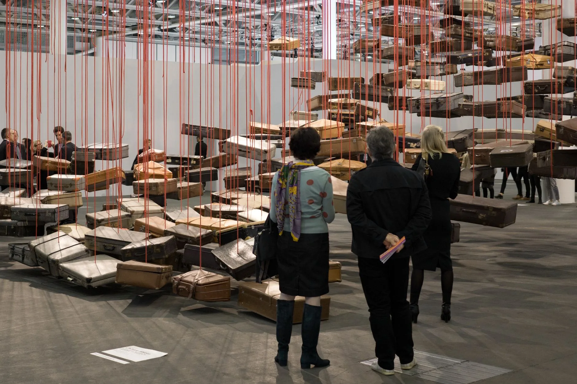 Industrial gallery with scattered, abstract spatial installations under soft, diffused lighting, types of installation a